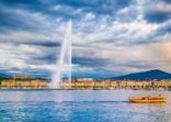 City of Geneva with Jet d'Eau fountain at sunset, Switzerland