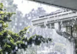 Torrential Summer Rain Storm Water Overflowing Roof Gutters