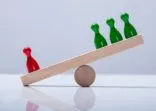 Pawns Figures On Wooden Seesaw