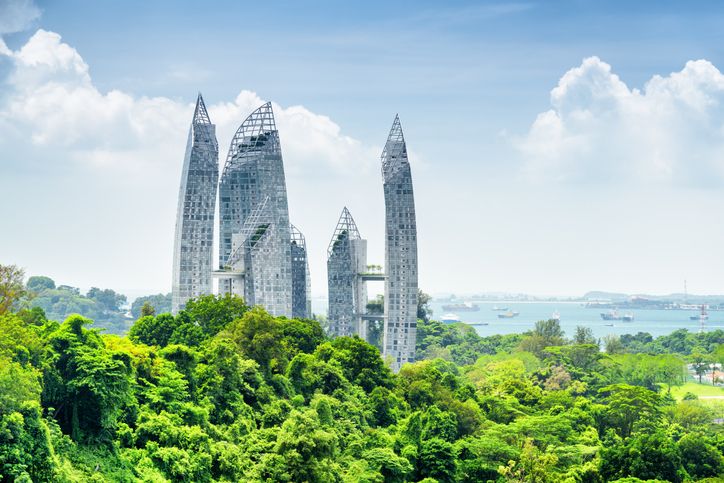 Cityscape in Singapore. Amazing skyscrapers among green trees