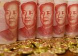 Yuan notes from China’s currency. Chinese banknotes. Chinese coins.The concept of wealth fund savings and financing.The head of Chinese leader Mao Zedong.