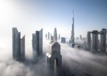 Dubai Downtown skyline on a foggy winter day.