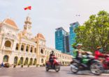 Ho Chi Minh City, Vietnam: Saigon City Hall, Vincom Center towers and colorful street traffic