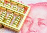 Gold abacus on Chinese yuan note