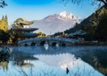 Beautiful of Black Dragon Pool with Jade Dragon Snow Mountain background, landmark and popular spot for tourists attractions near Lijiang Old Town. Lijiang, Yunnan, China