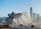 Construction machinery is demolishing the house