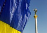 Independence square of Kiev and Ukrainan flag
