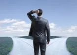 Businessman presented with the proverbial fork in the road