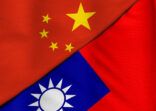 Two flags. People’s Republic of China and Taiwan.