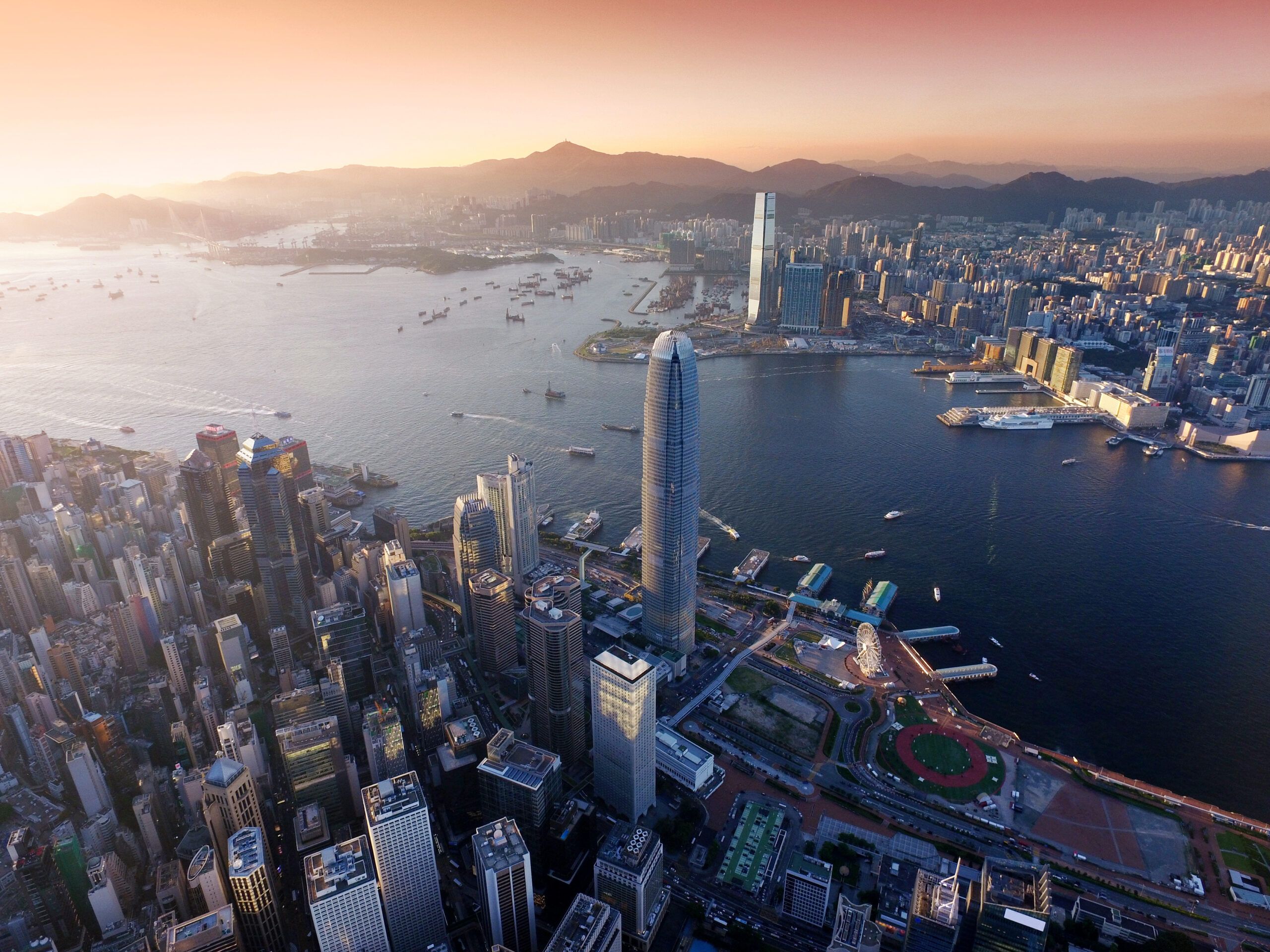 Aerial view of Hong Kong city, Victoria harbour in sunset