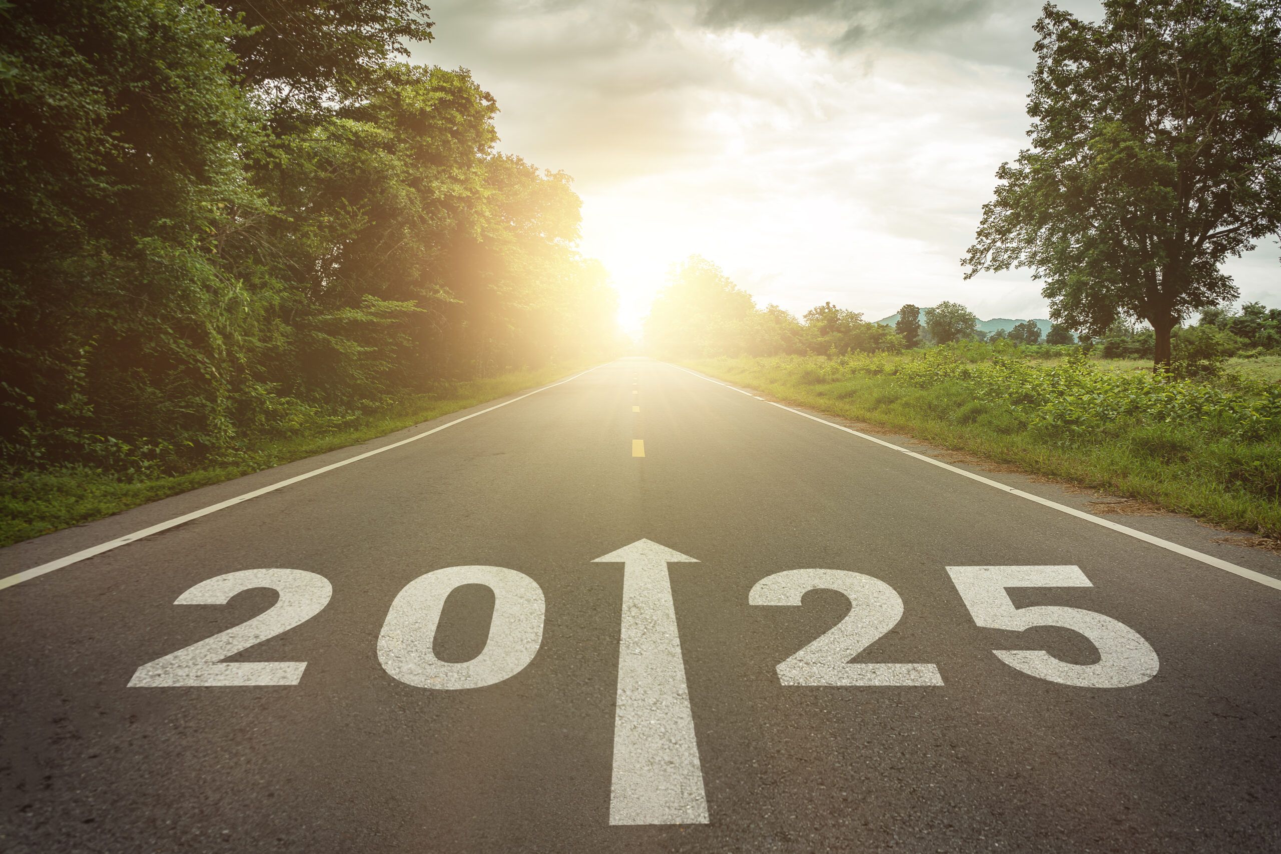 New year 2025 or straightforward concept. Text 2025 written on the road in the middle of asphalt road at sunset. Concept of planning , challenge, business strategy, opportunity ,hope, new life change.