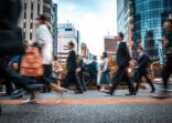 Blurred business people on their way from work