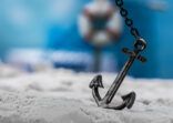 vintage anchor on the beach